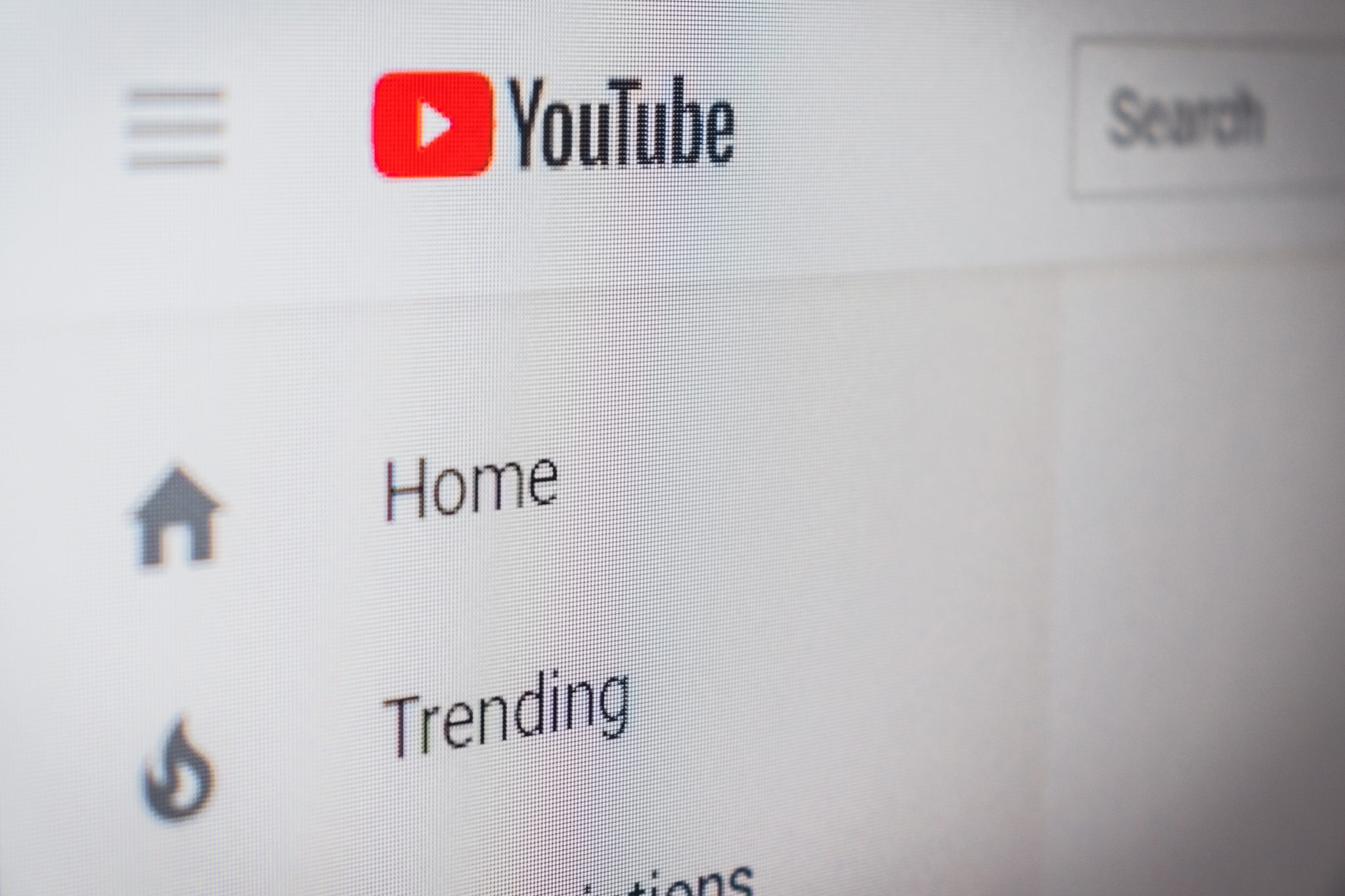 Close-up of the YouTube interface showing the logo and side menu
