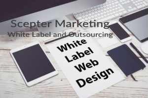 Tablet, phone, and notebook on a desk with paper labeled White Label Web Design