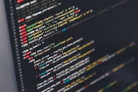 Close-up of colorful syntax-highlighted code on a dark monitor