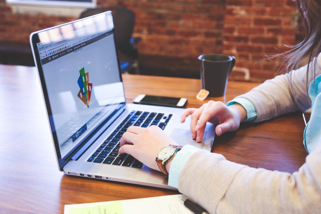 Using Video Ads to Promote Products and Services With a Call to Action on Facebook Messenger 17 person-typing-on-laptop