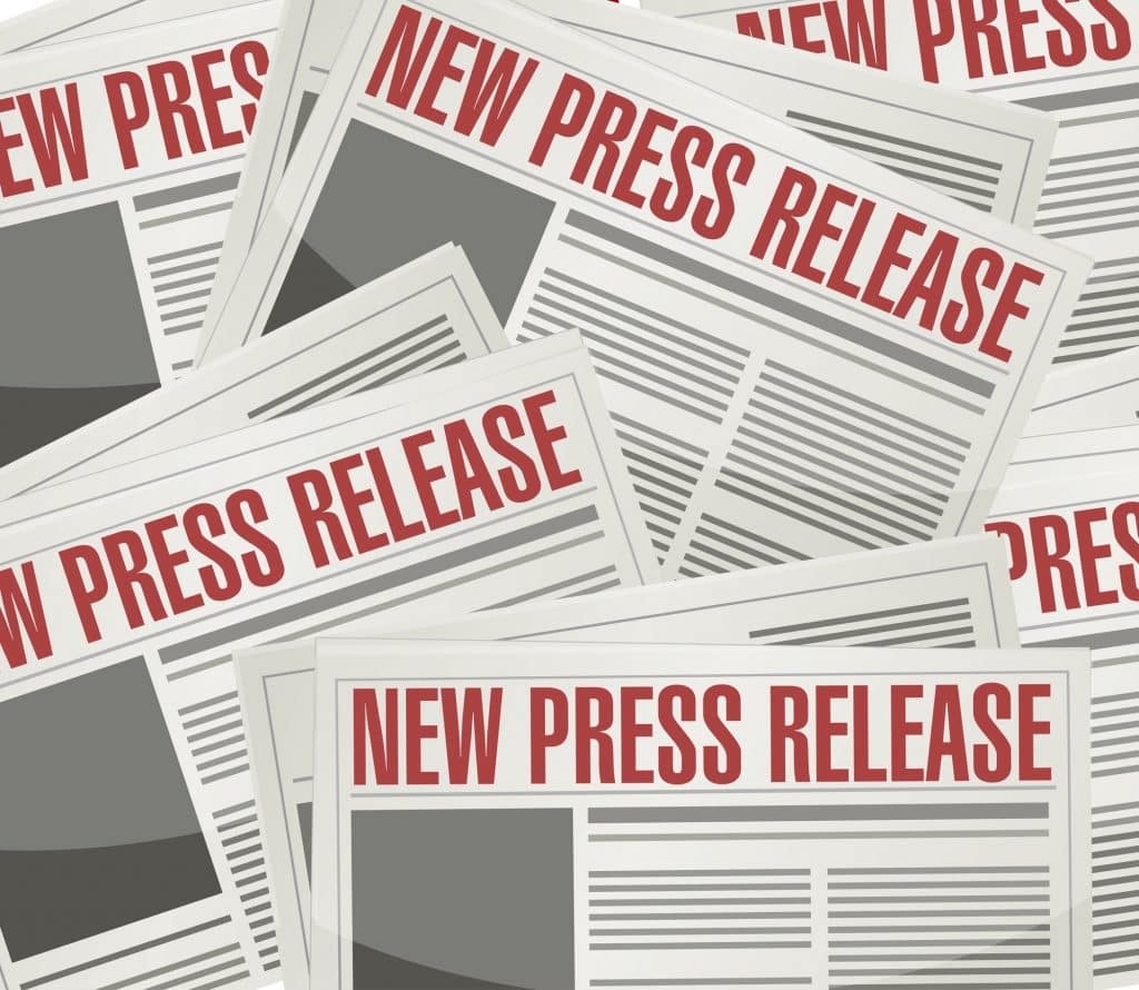 Stack of newspaper-style pages with bold red NEW PRESS RELEASE headlines